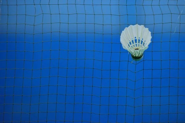 badminton shuttlecock on court